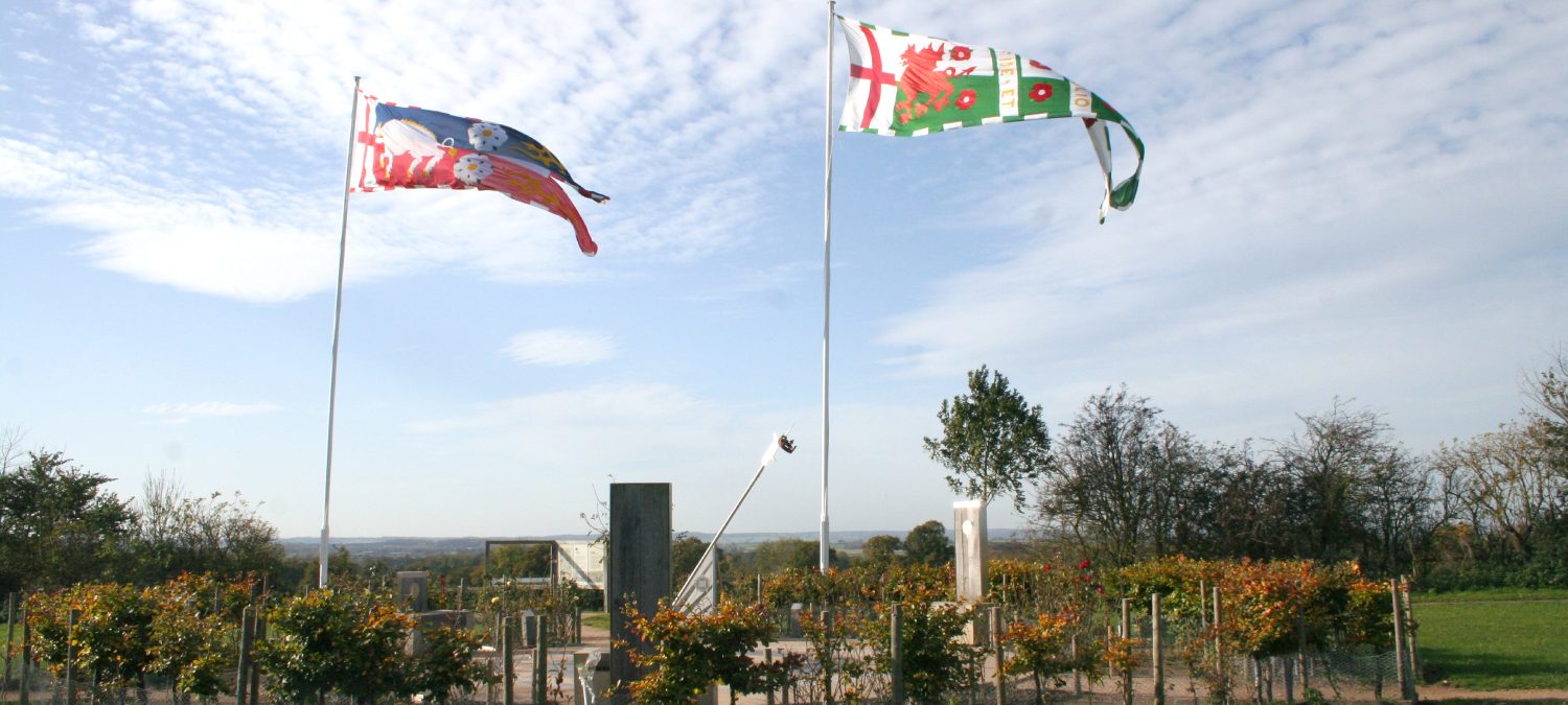 Bosworth Sundial Surrounded By Two Flags In The Air Aspect Ratio 2000 900
